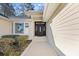 Elegant front door featuring decorative glass panels, surrounded by well-maintained landscaping at 1043 Yellow Jasmine Dr., Longs, SC 29568