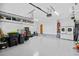 Spacious garage with epoxy floor, storage racks, and washer/dryer at 1043 Yellow Jasmine Dr., Longs, SC 29568