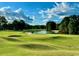 Golf course with blue skies, sand trap, and pond at 1043 Yellow Jasmine Dr., Longs, SC 29568