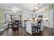 Bright kitchen with white cabinetry, stainless steel appliances, granite countertops and an eat in area at 1043 Yellow Jasmine Dr., Longs, SC 29568