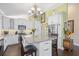 Bright kitchen featuring an island with seating, granite countertops, and stainless steel appliances at 1043 Yellow Jasmine Dr., Longs, SC 29568