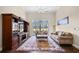 Bright living room featuring a built-in entertainment center, plush sofas, and sliding glass doors to the outside at 1043 Yellow Jasmine Dr., Longs, SC 29568
