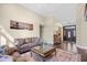 Cozy living room with a plush brown sofa and views into the foyer at 1043 Yellow Jasmine Dr., Longs, SC 29568