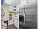 Well-organized pantry offers ample storage with shelving and a stainless steel refrigerator at 1043 Yellow Jasmine Dr., Longs, SC 29568