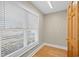 An empty room features hardwood floors, base trim, and natural light at 1043 Yellow Jasmine Dr., Longs, SC 29568