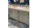 Bright bathroom with a dual sink vanity, marble countertop, and blue accent rugs at 1101 Louise Costin Ln. # 1308, Murrells Inlet, SC 29576