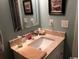 Bathroom vanity with marble countertop and decorative mirror at 1101 Louise Costin Ln. # 1308, Murrells Inlet, SC 29576