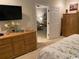 Bedroom with a dresser, flat screen television, and a doorway leading to another room at 1101 Louise Costin Ln. # 1308, Murrells Inlet, SC 29576