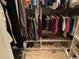 Organized closet space with clothes, shoes, and shelving at 1101 Louise Costin Ln. # 1308, Murrells Inlet, SC 29576