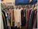 Organized walk-in closet with hanging clothes and shelving at 1101 Louise Costin Ln. # 1308, Murrells Inlet, SC 29576