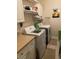 Convenient laundry room with modern washer and dryer, plus ample storage and countertop space at 1101 Louise Costin Ln. # 1308, Murrells Inlet, SC 29576