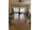 Spacious living room with tile floors and large windows providing ample natural light at 1101 Louise Costin Ln. # 1308, Murrells Inlet, SC 29576