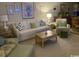 Cozy living room with comfortable seating, lamps, and a decorative coffee table at 1101 Louise Costin Ln. # 1308, Murrells Inlet, SC 29576