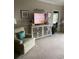 Cozy living room featuring plush armchair and modern entertainment center at 1101 Louise Costin Ln. # 1308, Murrells Inlet, SC 29576