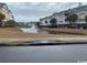 Scenic view of a pond with a fountain, enhancing the community's appeal and landscape at 1101 Louise Costin Ln. # 1308, Murrells Inlet, SC 29576