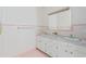 Charming bathroom with dual sinks, floral wallpaper, and ample counter space at 115 Carolina Ave., Mullins, SC 29574