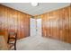Wood paneled bedroom with carpet, showing closet and hallway doors at 115 Carolina Ave., Mullins, SC 29574