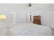 Primary bedroom with a ceiling fan, an ensuite bathroom and ample closet space at 115 Carolina Ave., Mullins, SC 29574