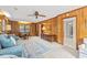Spacious living room with wood paneled walls, built-in bookshelves, and comfortable seating at 115 Carolina Ave., Mullins, SC 29574