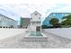 A modern backyard featuring a pool, spa, paved patio and neighboring beach homes at 1211-B N Waccamaw Dr., Garden City Beach, SC 29576