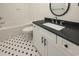 Bathroom with a white vanity and black countertop at 1211-B N Waccamaw Dr., Garden City Beach, SC 29576