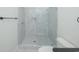 New bathroom showcasing an enclosed glass shower with hexagon tile flooring at 1211-B N Waccamaw Dr., Garden City Beach, SC 29576
