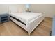 Spacious bedroom with a bed and side tables at 1211-B N Waccamaw Dr., Garden City Beach, SC 29576