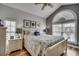 Cozy bedroom with nautical-themed bedding, arched window, and ceiling fan at 1411 Powhaton Dr., Myrtle Beach, SC 29577