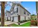 Exterior view of a two-story home with a well-maintained lawn and two-car garage at 1411 Powhaton Dr., Myrtle Beach, SC 29577