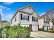 Two-story home with a well-manicured lawn and attached two-car garage at 1411 Powhaton Dr., Myrtle Beach, SC 29577