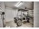 Well-lit garage featuring a gray golf cart with custom wheels at 1411 Powhaton Dr., Myrtle Beach, SC 29577