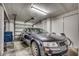 Spacious garage featuring a dark grey car and plenty of room for storage at 1411 Powhaton Dr., Myrtle Beach, SC 29577