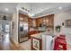 Modern kitchen with stainless steel appliances, breakfast bar, and tile flooring at 1411 Powhaton Dr., Myrtle Beach, SC 29577