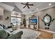 Bright living room with tray ceiling, hardwood floors, and coastal decor at 1411 Powhaton Dr., Myrtle Beach, SC 29577