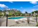 Community pool featuring a variety of lounge chairs and tables beneath the clear blue sky at 1411 Powhaton Dr., Myrtle Beach, SC 29577