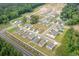 Aerial view of a residential community featuring modern homes, lush landscaping, and community pond at 1450 Nokota Dr., Conway, SC 29526