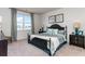 Cozy bedroom with a wrought iron bed frame and a scenic waterfront view from the window at 1450 Nokota Dr., Conway, SC 29526