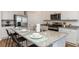 Modern kitchen features granite countertops, stainless steel appliances, and an eat-in island at 1450 Nokota Dr., Conway, SC 29526