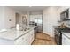 Modern kitchen with stainless steel appliances, granite countertops, and an island with barstool seating at 1450 Nokota Dr., Conway, SC 29526