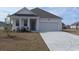 Charming single-story home with well-maintained lawn and attached two-car garage at 1460 Porchfield Dr., Conway, SC 29526