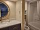 Standard bathroom with shower and vanity with round mirror at 1501 S Ocean Blvd. S # 1041, Myrtle Beach, SC 29577