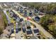 An aerial view of a charming home in a well-kept neighborhood with mature trees and landscaping at 159 Terracina Circle, Myrtle Beach, SC 29588