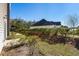 Backyard featuring a lush lawn and well-maintained landscaping with a view of neighboring properties at 159 Terracina Circle, Myrtle Beach, SC 29588