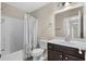 This bathroom includes a vanity with dark wood cabinets, toilet, and a shower/tub combo at 159 Terracina Circle, Myrtle Beach, SC 29588