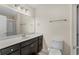 This bathroom offers a dark wood vanity with white countertop and a walk-in shower at 159 Terracina Circle, Myrtle Beach, SC 29588