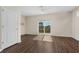 Bright bedroom features wood-look flooring, neutral walls, a ceiling fan, and sliding glass door at 159 Terracina Circle, Myrtle Beach, SC 29588