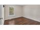 This bedroom features wood-look floors, neutral walls, and a window at 159 Terracina Circle, Myrtle Beach, SC 29588