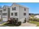 Two-story home with grey siding, black shutters, an attached garage, and a well-manicured front yard at 159 Terracina Circle, Myrtle Beach, SC 29588