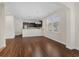 Bright, open-concept living space featuring hardwood floors, view to the kitchen, and natural light at 159 Terracina Circle, Myrtle Beach, SC 29588