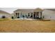 Expansive backyard with patio areas and a screened-in porch, perfect for enjoying outdoor living at 161 Copper Leaf Dr., Myrtle Beach, SC 29588